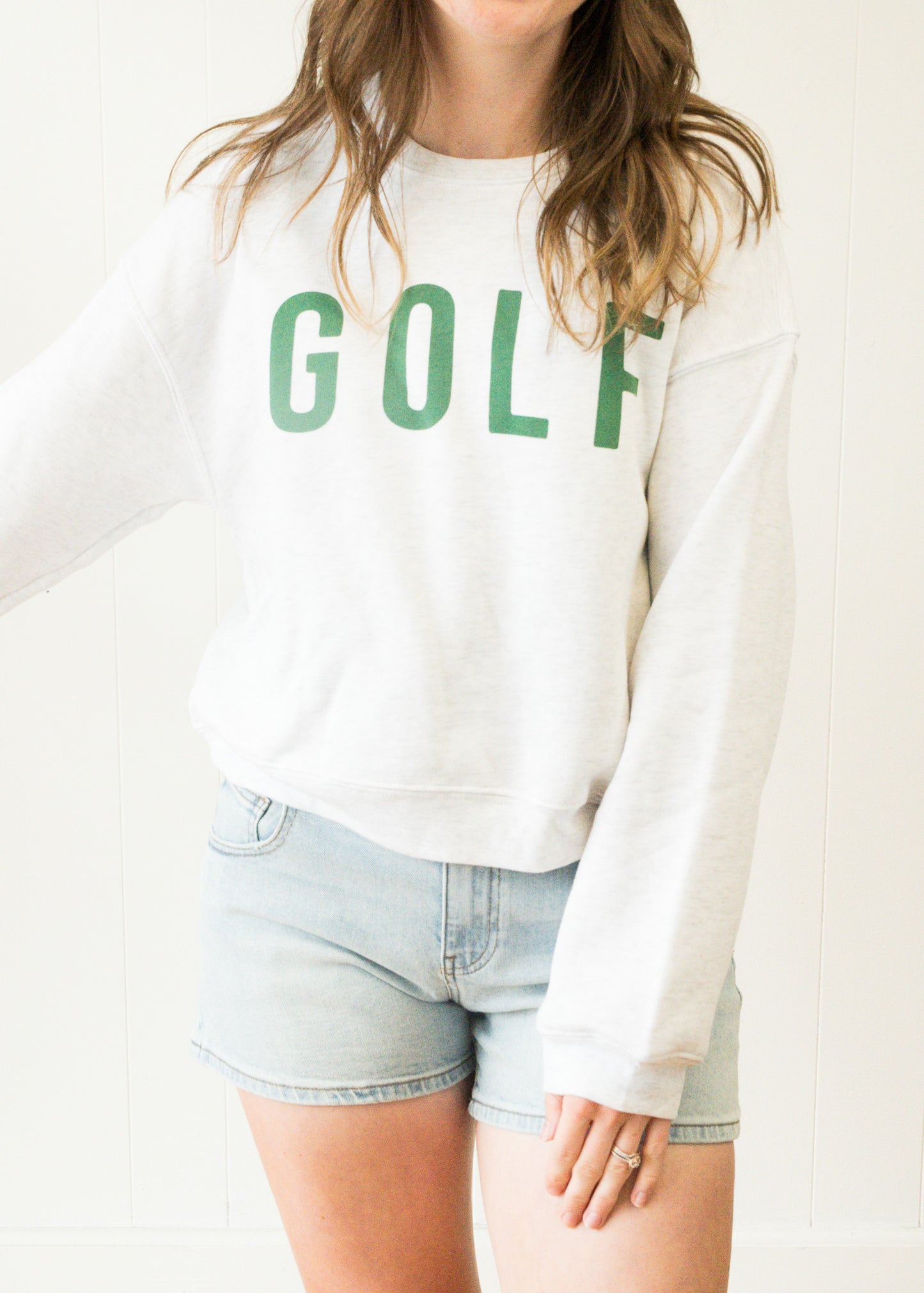 Golf Mid length Cropped Graphic Fleece Pullover Relaxed Fit.